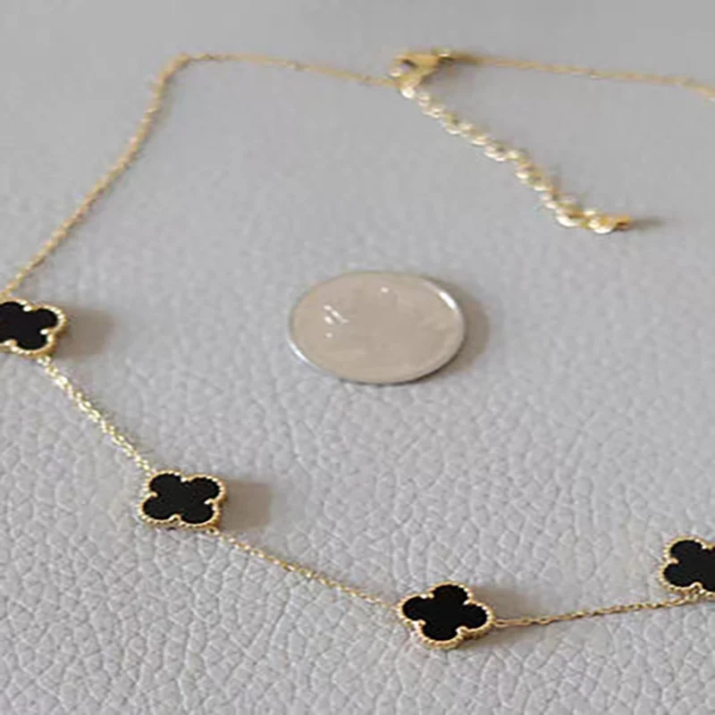 5 cloverr Elegant gold clover necklace with black clover accents for daily wear