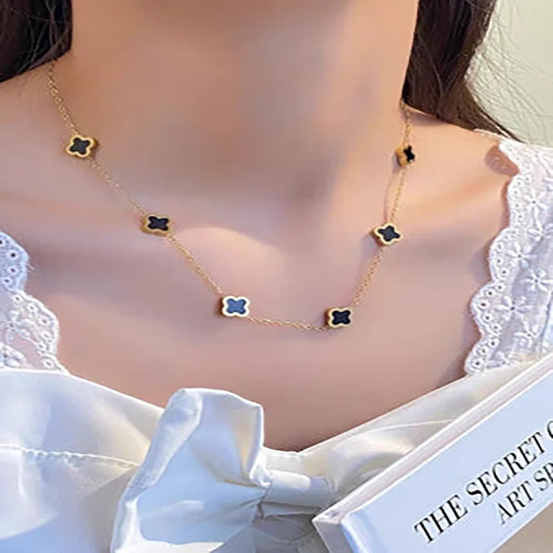 clover3 Elegant gold clover necklace with black clover accents for daily wear